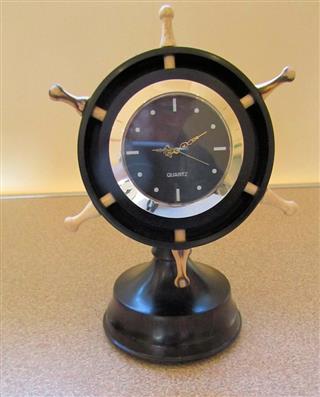 Clock in ships wheel by Bill Burden